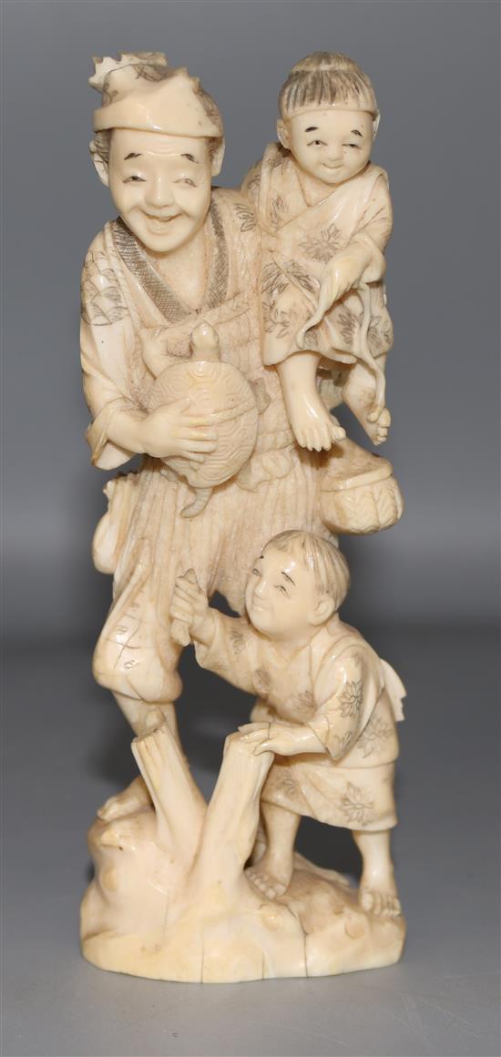 A Japanese walrus ivory group of a fisherman and two boys
